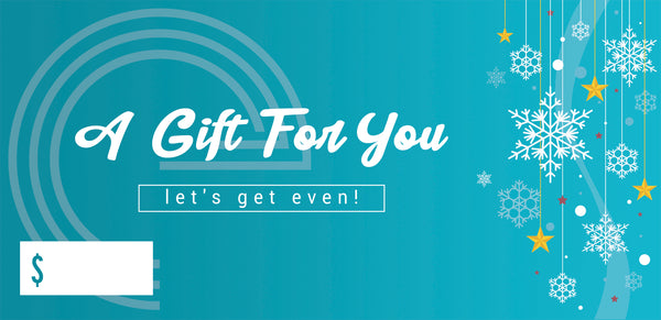 The front of the gift certificate, which is teal blue with white snowflakes and has "A gift for you" and "let's get even!" written on them. There is a blank space for the amount of the voucher to be written in. 